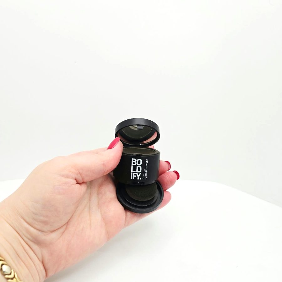 My Boldify Hairline Powder open in my hand, with the puff underneath