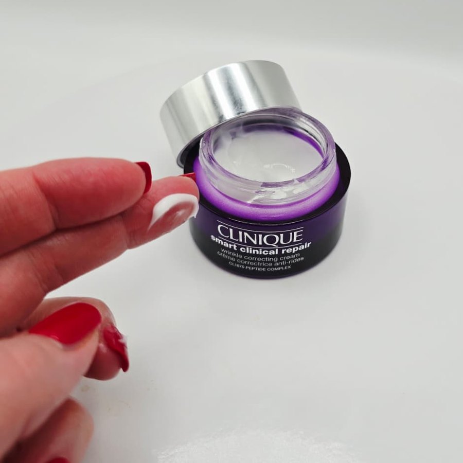 Clinique Wrinkle Correcting Cream on my fingertip, next to the open jar