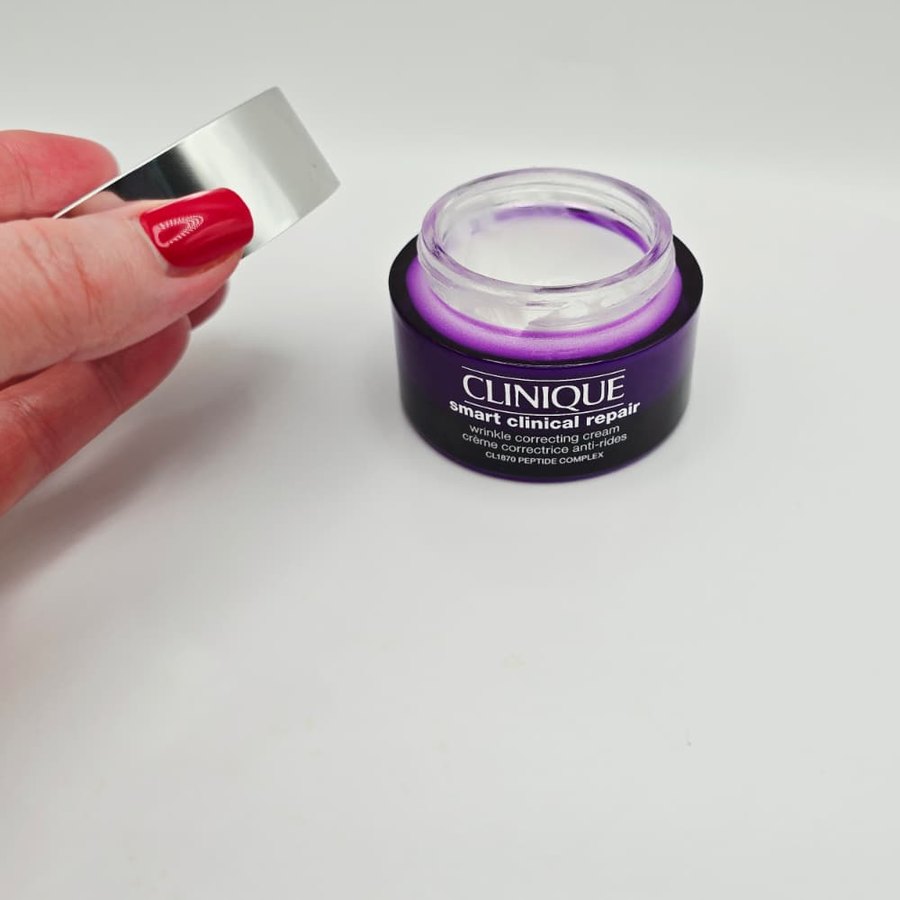 The Clinique Wrinkle Correcting Cream jar open, with the silver lid in my hand