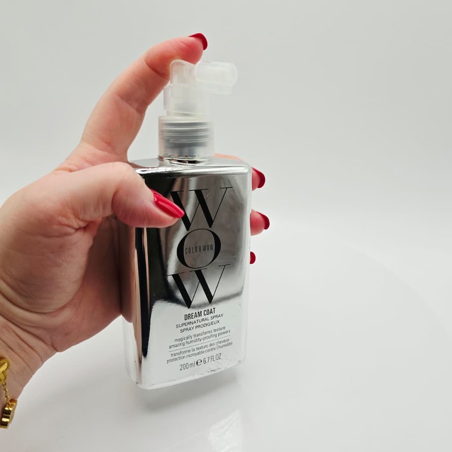 My bottle of Color Wow Dream Coat in my hand, ready to spray