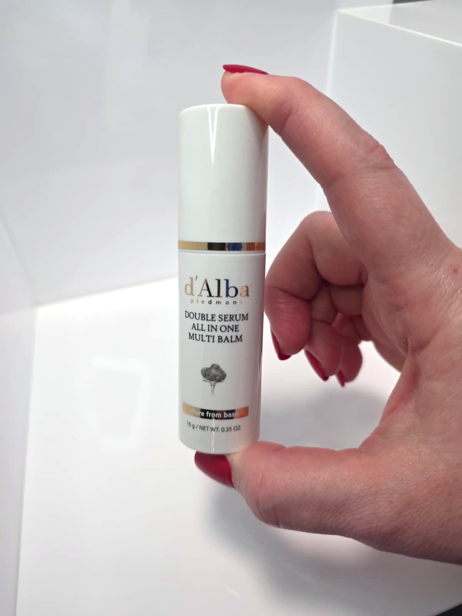 Holding the d'Alba multi balm stick in my hand to show the size