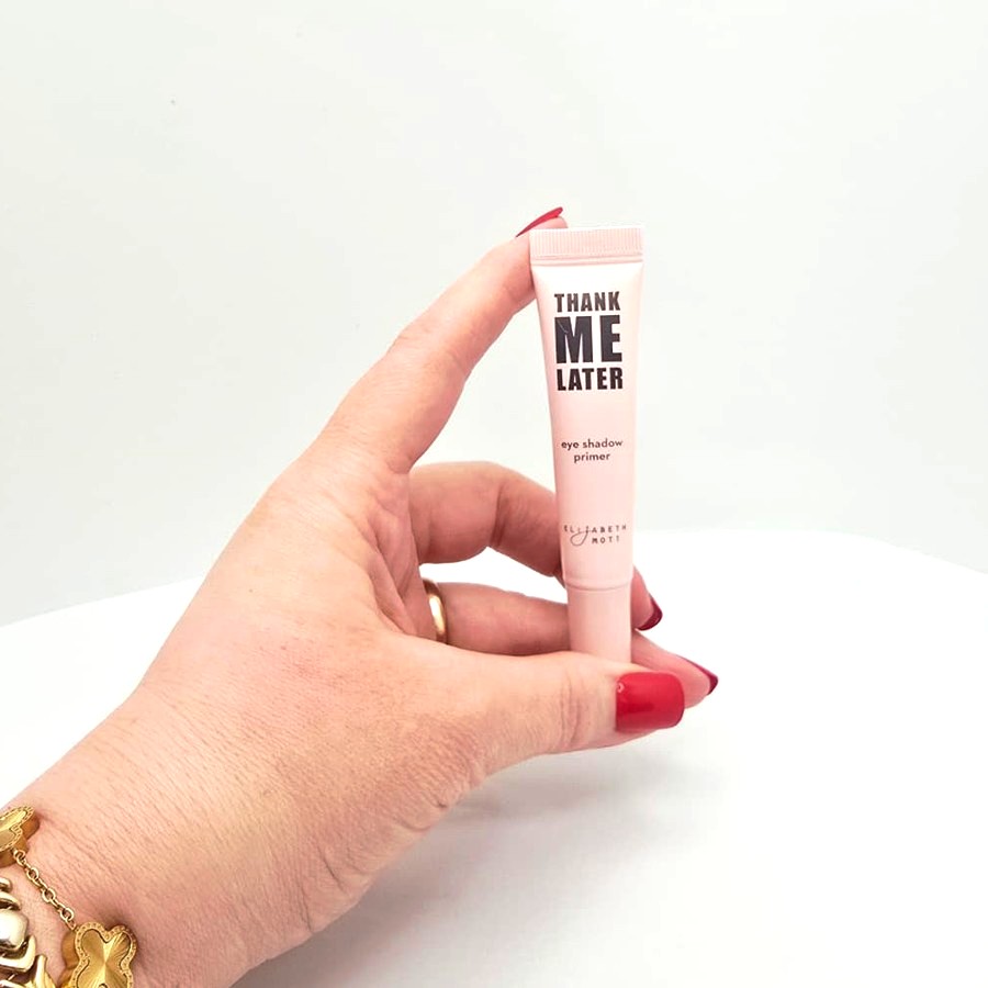 My hand holding my Elizabeth Mott Thank Me Later eyeshadow primer