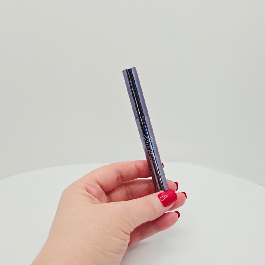 My hand holding my Julep eyeshadow stick
