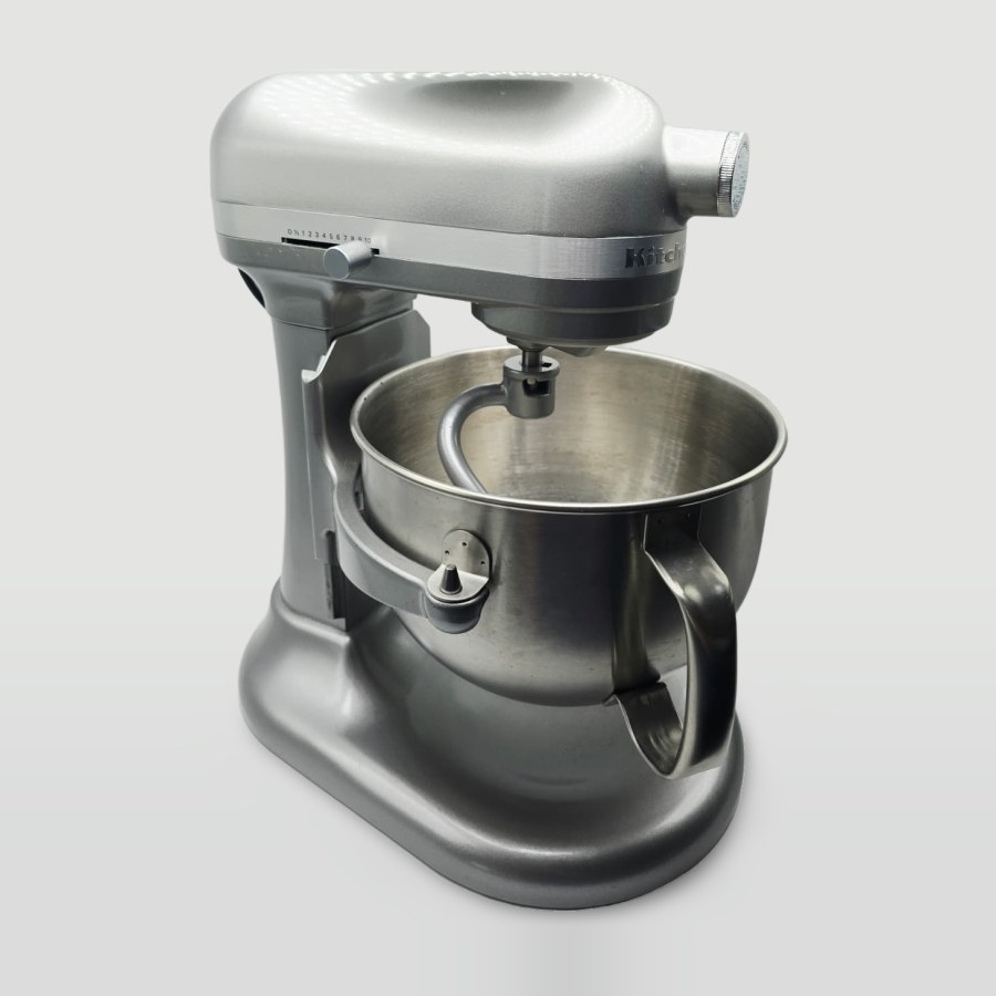 My silver KitchenAid bowl-lift stand mixer seen from the side, with the dough hook in the bowl