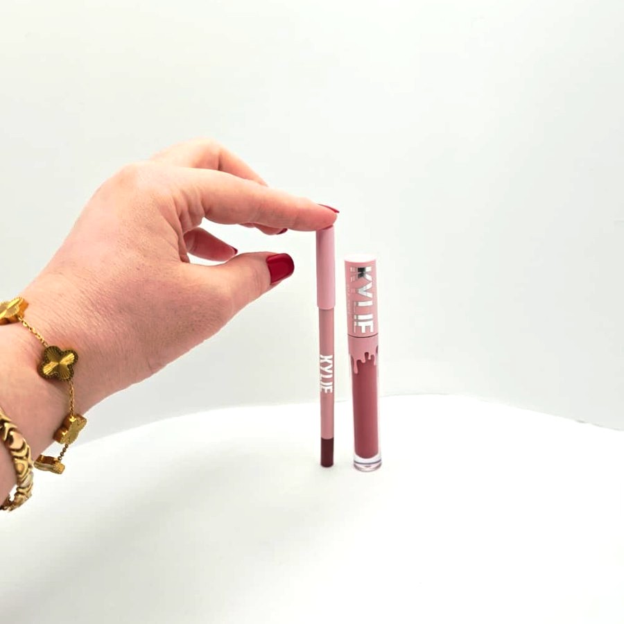 My hand touching the Kylie lip liner next to the liquid lipstick