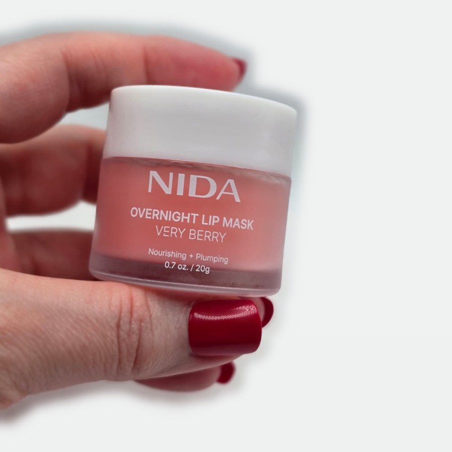 My NIDA Overnight Lip Mask in Very Berry, held in my hand