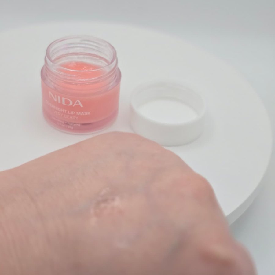 A little NIDA lip mask on the back of my hand, with the open jar behind