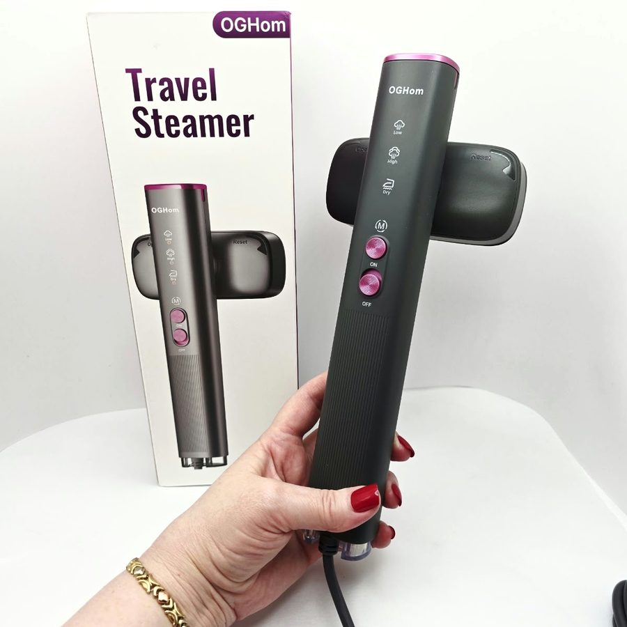 My hand holding the OGHom steamer, showing the Low, High and Dry settings