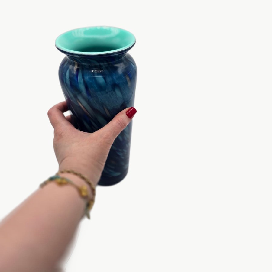 Holding my blue PlivBloom glass vase with its turquoise inside and swirled blue pattern