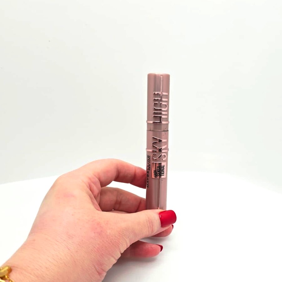 My hand holding my closed Maybelline Sky High mascara