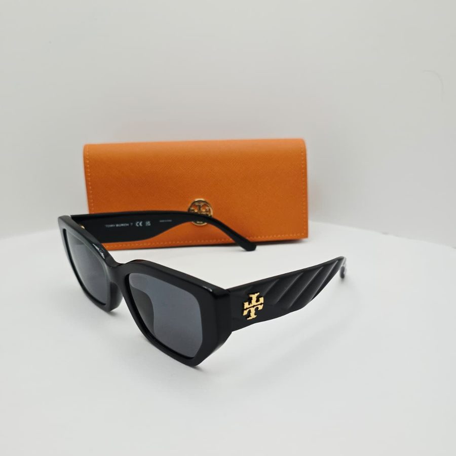 My Tory Burch Kira sunglasses from the side, showing the gold logo and quilted temples