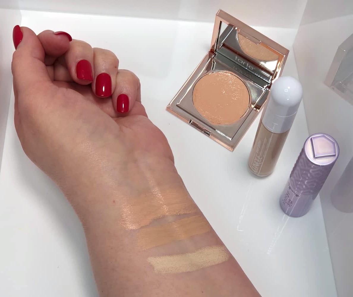 All three concealers on my counter, with swatches on my arm, top to bottom: tarte Colored Clay CC corrector, Clinique Even Better Eraser, tarte Shape Tape Blur