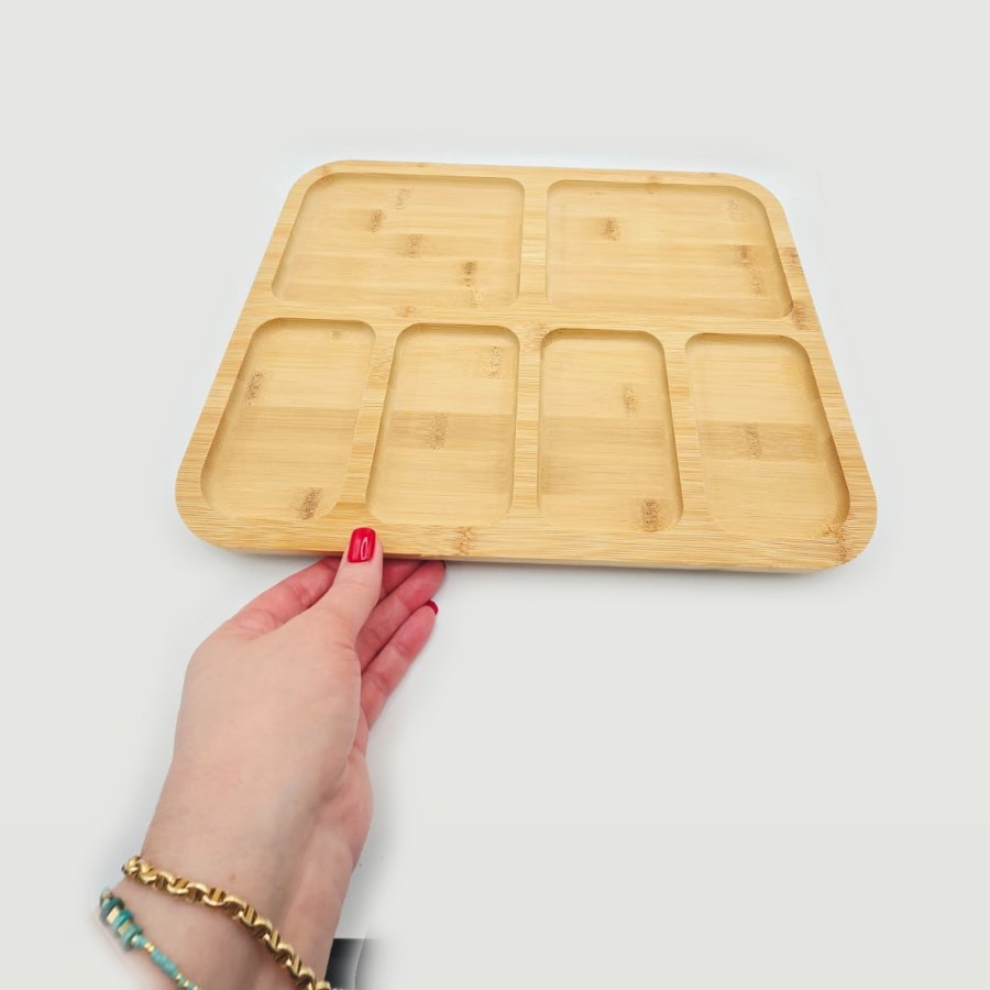 My bamboo charcuterie board without the lid, showing its six compartments