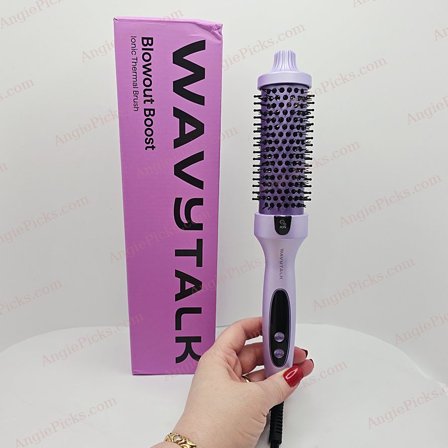 My hand holding the Wavytalk Blowout Boost next to its box
